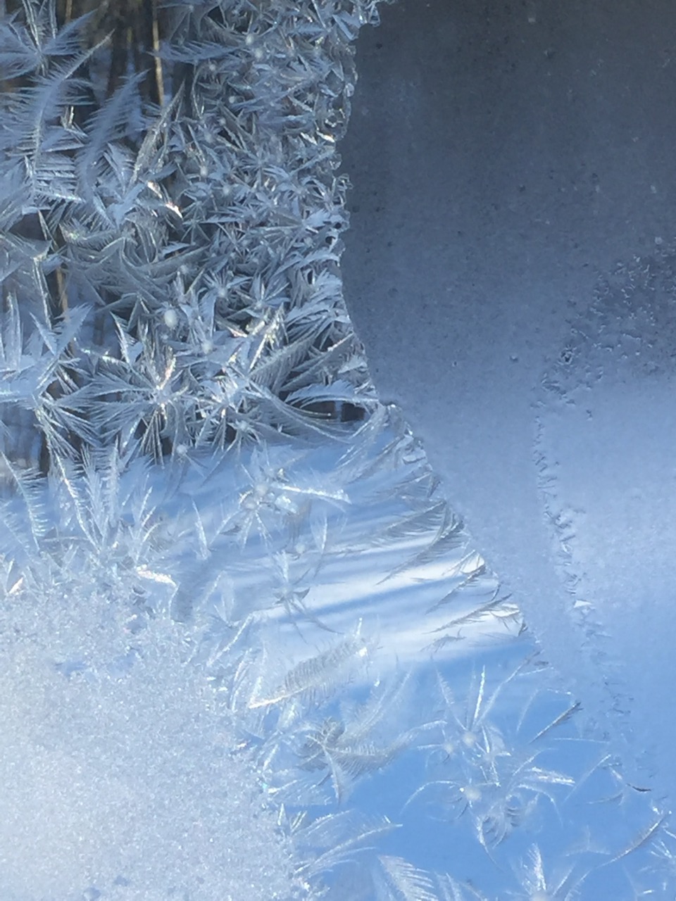 Morning moisture crystal formations on glass